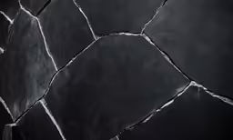 a close up of a black slate wall