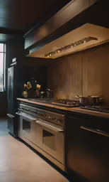 an elegant kitchen has a stainless steel stove, oven and wall