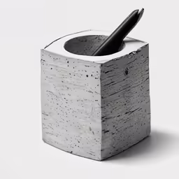 this is a block of concrete that holds a pen