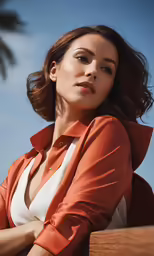 a woman posing in a red and white shirt