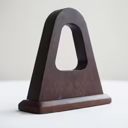 a modern piece of wood sits on a table