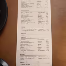 a paper receipt sitting on top of a table