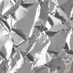 a wall made up of leaves in black and white