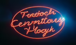 this neon sign has an oval frame with the words tech genntotorys hooy