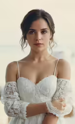 a woman posing for the camera in a wedding dress