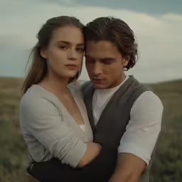 a man and a woman looking down at each other