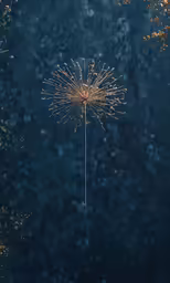 a golden sparkler is blowing in the air