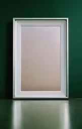 a rectangular frame on the ground in front of a green wall