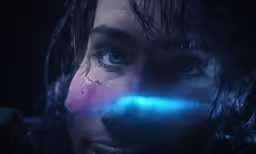 a woman with wet hair staring at a light