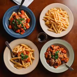 plates of food on a table next to cups