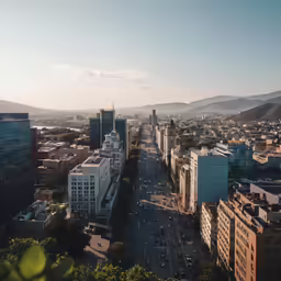 a view from the top of a tall building with a cityscape in the foreground