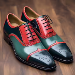 a pair of green and red shoes sitting on top of a wooden floor,green and red shoe with brown soles on a wooden floor