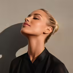 the woman has her face almost to her side