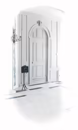 white interior with doors and chandelier near floor