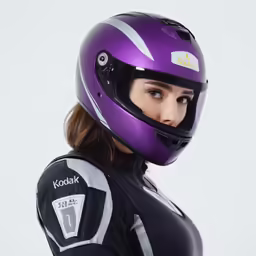 woman in purple motorcycle helmet in black suit