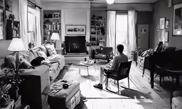 a woman is sitting in the living room while reading