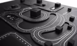 a large black table has many road shapes on it