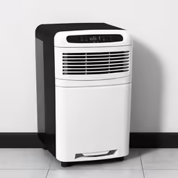 a small white and black air conditioner against a wall