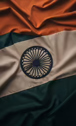 a decorative orange, green, and beige cloth