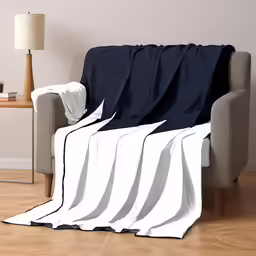a large black and white blanket draped over a couch