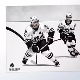 an advertisement featuring two hockey players, one in black and white