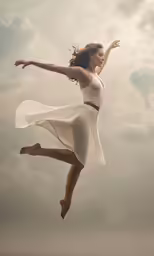 a woman in a dress leaps into the air