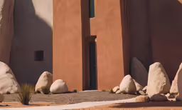 a building that has some rocks next to it