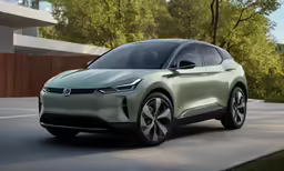 the volkswagen ion electric suv parked in front of some trees