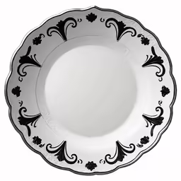 the white and black plate with a design on it