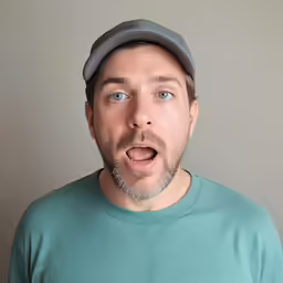 a man making a surprised face with his mouth wide open