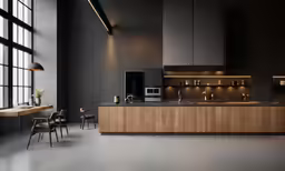 a modern kitchen that is decorated in dark shades