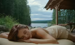 the naked girl is laying on the ground