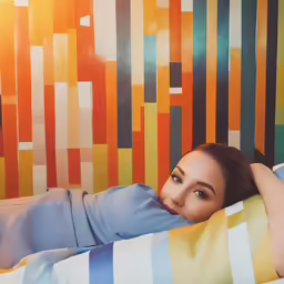 a woman laying on her stomach on the floor
