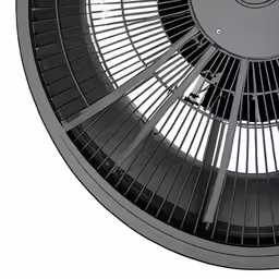 a black ceiling fan is set on its side