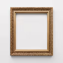 a gold colored picture frame sitting on the wall