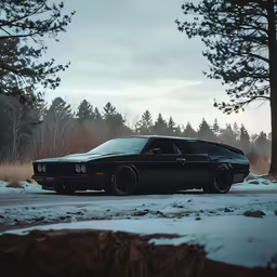an old car parked in the snow next to a road