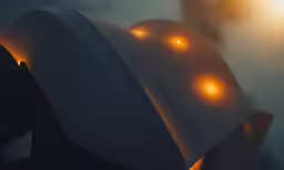a hat is shown lit up by yellow light