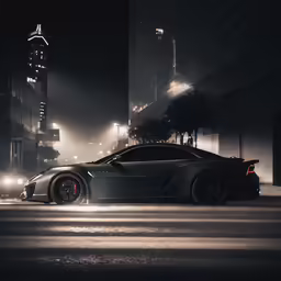black sports car parked in a dark street
