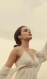 an image of a woman holding something in her hand