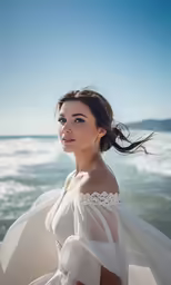 a woman in white is on the beach