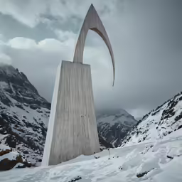 a strange structure is sticking out in the snowy terrain
