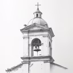 a tall bell tower with a cross on top