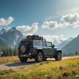 a black jeep driving down a country road