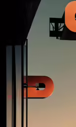 the top of a building with a clock in front of it