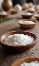some wooden bowls filled with rice and sitting on the table