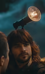 a man with a weird looking light bulb on his head