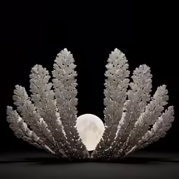 a full moon is behind some pretty, light - up, coral like trees