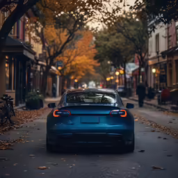 a car is parked in front of a row of buildings