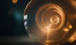 a view from below a shiny round object with circles