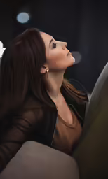 a close up of a person sitting on a couch